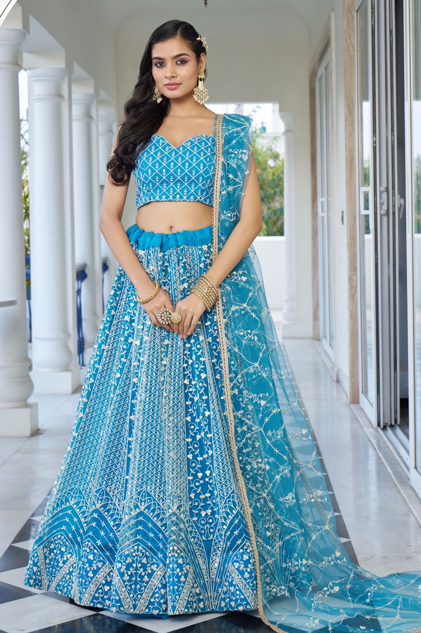 Turquoise Net Embroidered Lehenga Choli