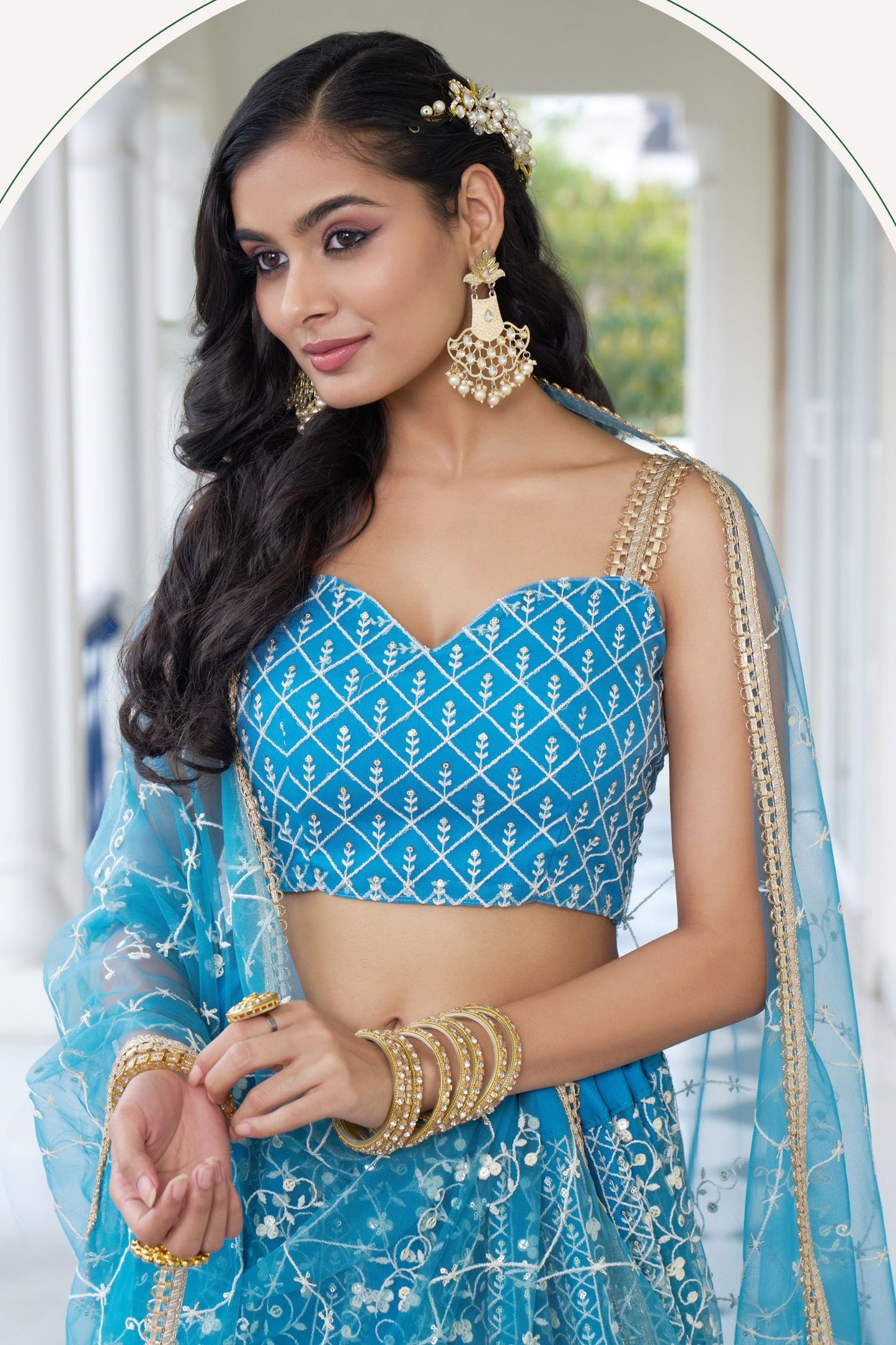 Turquoise Net Embroidered Lehenga Choli