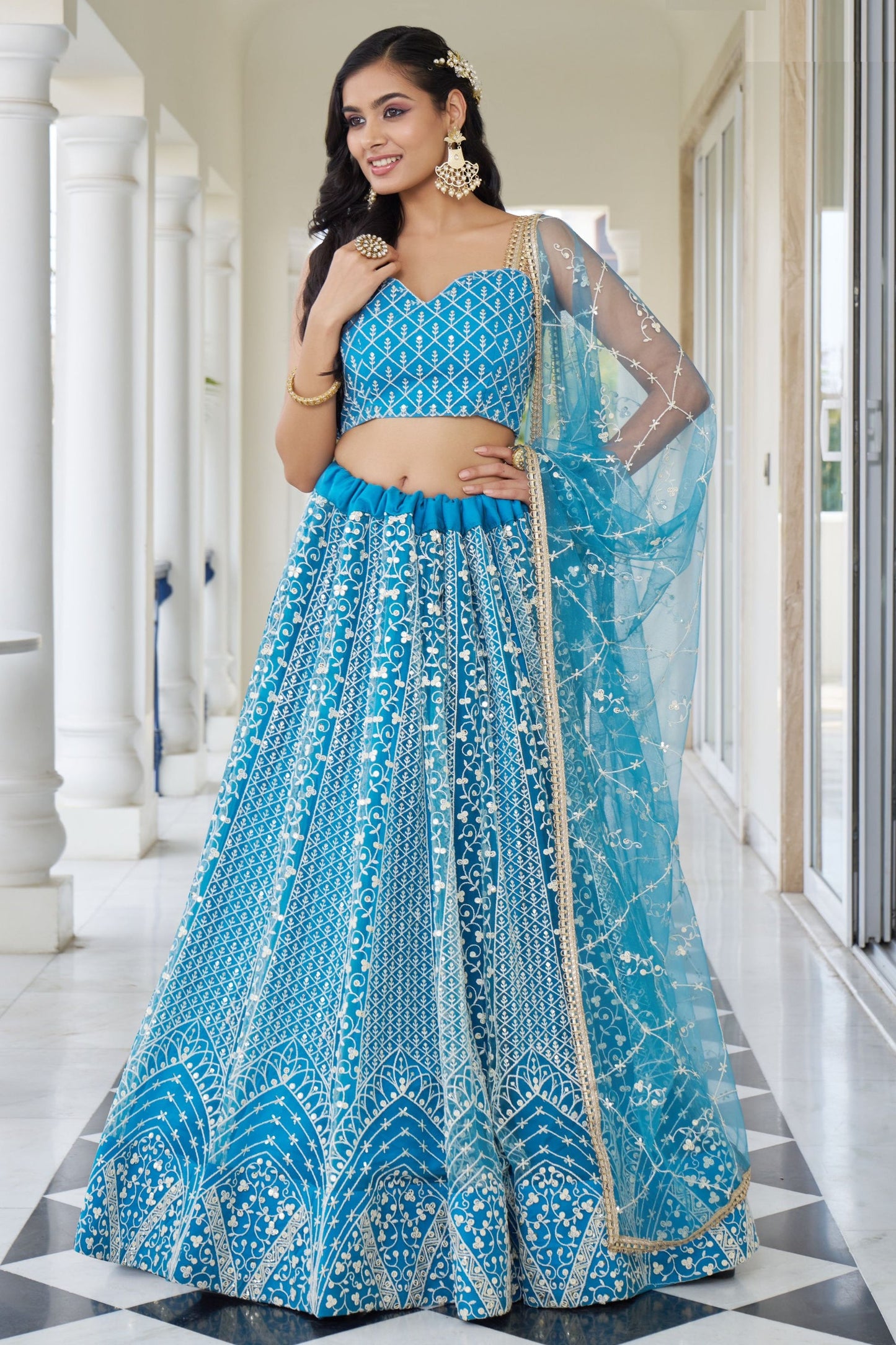 Turquoise Net Embroidered Lehenga Choli